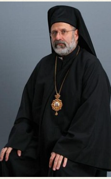 His Grace Bishop John in monastic klobuk, seated