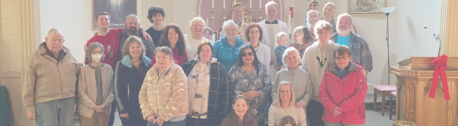 The parish community gathered together inside the church before the altar