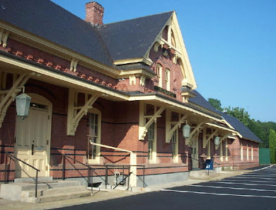 The historic red-brick West Brookfield train station, with its steep gabled rooflines and ornate Victorian woodwork, where Emmanuel held its first public worship services.